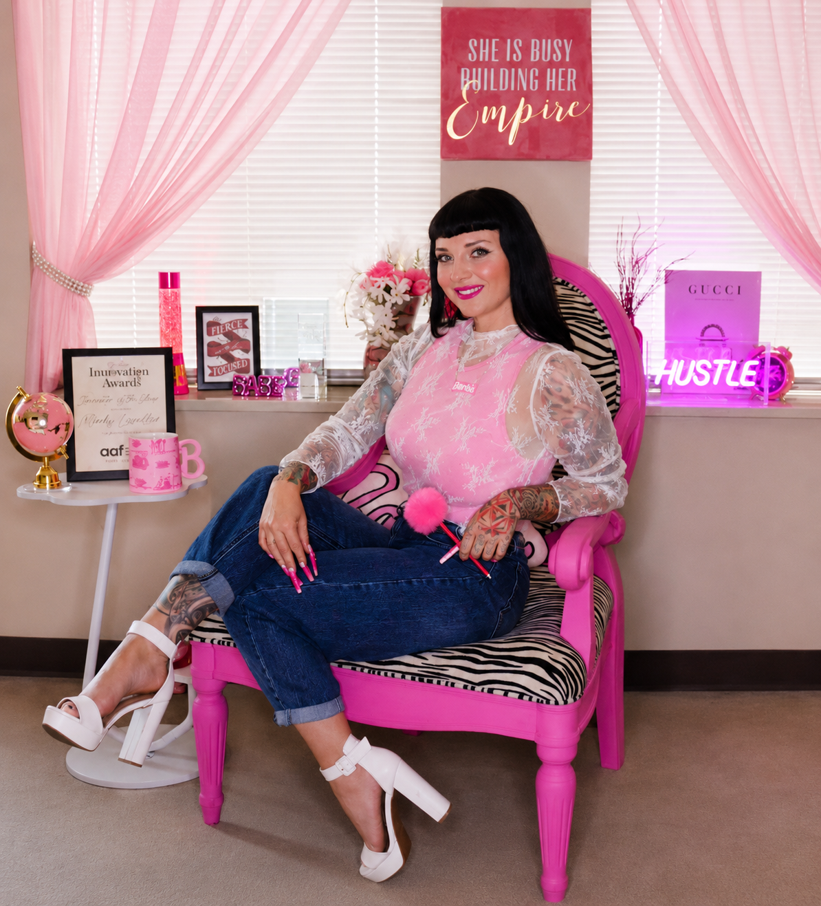 Mindy seated in her pink chair at the Starfish office